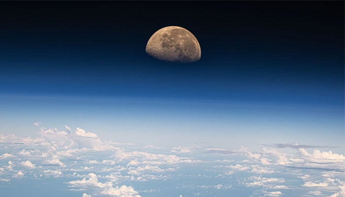 This image shows a unique angle of a moonrise right above Earths atmosphere. — X/@dominickmatthew