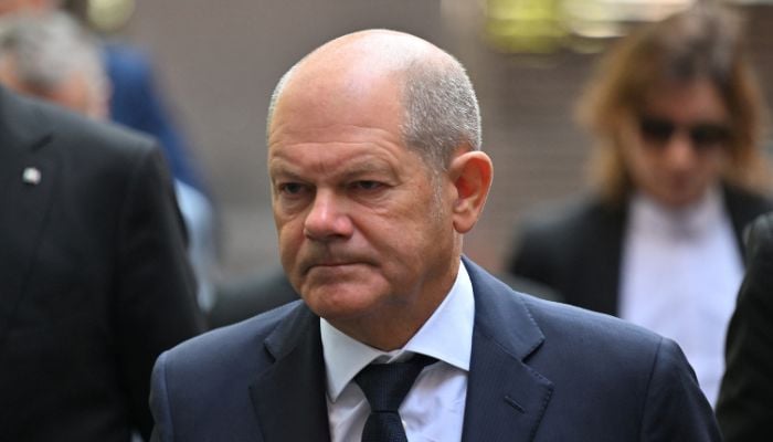 German Chancellor Olaf Scholz arrives at the town hall before visiting the site where three people were killed and several injured in a stabbing attack at a festival, in Solingen, Germany, August 26, 2024. — Reuters