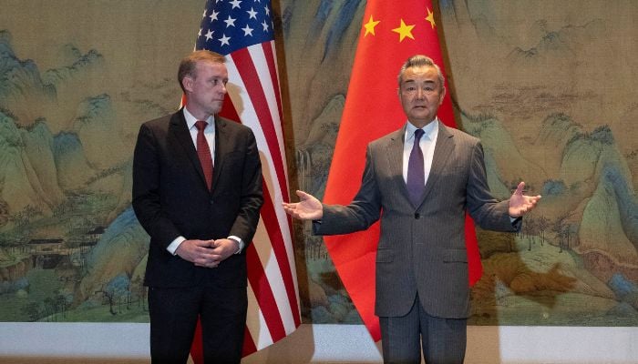 White House National Security Adviser Jake Sullivan (L) looking at Wang Yi, the director of the Communist Partys Central Foreign Affairs Commission Office while he speaks before talks at Yanqi Lake in Beijing, China, August 27, 2024. — Reuters