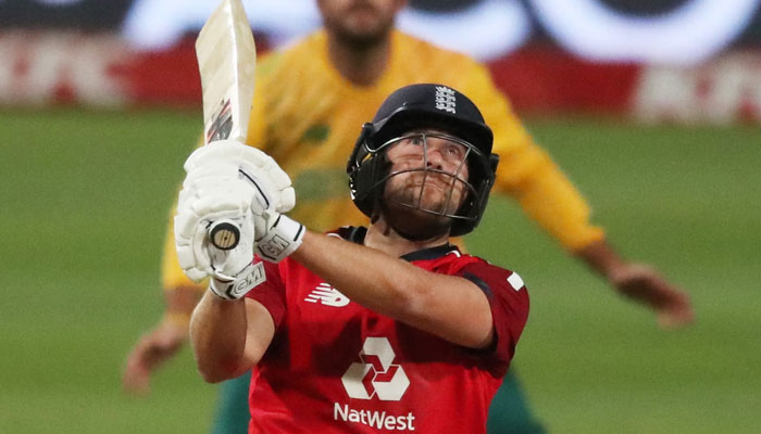 Dawid Malan watches another a six flying towards the boundary during his unbeaten 99 for England against South Africa in the third T20I. — Reuters