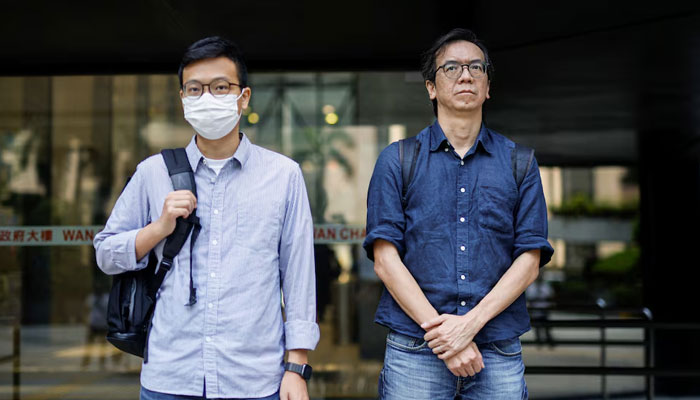 Chung Pui-kuen, former chief editor of the now-shuttered Stand News, and Patrick Lam, former acting chief editor, leave the District Court during the hearing on charges of conspiring to publish seditious publications, in Hong Kong, China on June 27, 2023. — Reuters