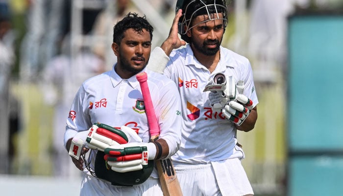 Bangladeshs Shadman Islam (R) and Zakir Hasan (L) walk back to the pavilion after their teams win at the end of the fifth and final day of the first Test cricket match between Pakistan and Bangladesh at the Rawalpindi Cricket Stadium in Rawalpindi on August 25, 2024. — AFP