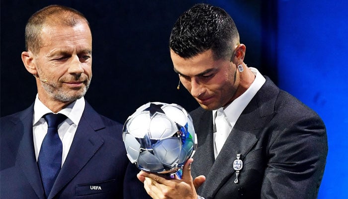 Cristiano Ronaldo looks at his UEFA Champions League all-time leading goalscorer award during the leagues draw ceremony at Grimaldi Forum in Monaco on August 29, 2024. — Instagram/@cristiano