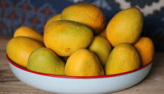 A representational image of mangoes. — Unsplash