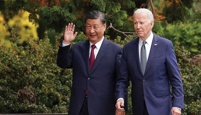 Chinese President Xi Jinping waves as he walks with US President Joe Biden at Filoli estate on the sidelines of the Asia-Pacific Economic Cooperation (APEC) summit, in Woodside, California, US, November 15, 2023. — Reuters