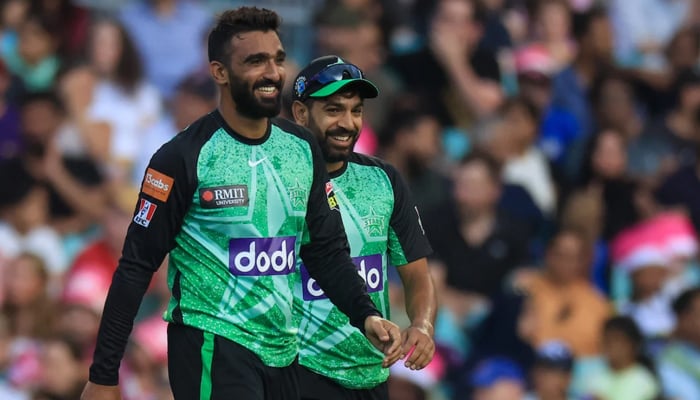 Pakistani leg-spinner Usama Mir walks ahead of pacer Haris Rauf while representing Melbourne Stars against Sidney Sixers on December 26, 2023. — Cricket Australia (CA)