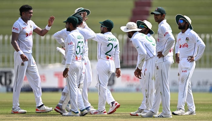 Bangladeshs Taskin Ahmed (L) celebrates with teammates after taking wicket of Saim Ayub during fourth day of second Test match between Pakistan and Bangladesh, at Rawalpindi Cricket Stadium in Rawalpindi on September 2, 2024. —AFP