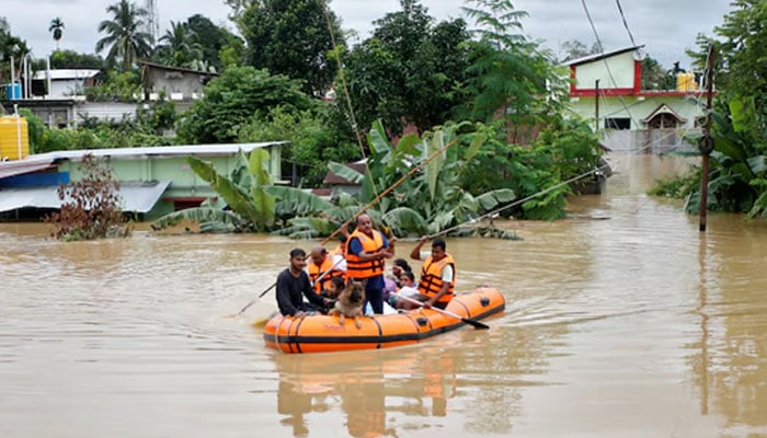 Rescuers from Tripura Disaster Management Authority evacuate flood-affected people to a safer place following heavy rains at a village on the outskirts of Agartala, India, August 22, 2024. — Reuters