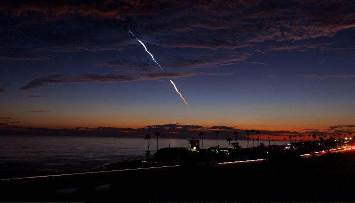 An evening launch of a SpaceX Falcon 9 rocket carrying 20 Starlink V2 Mini satellites, from Space Launch Complex at Vandenberg Space Force Base is seen over the Pacific Ocean from Encinitas, California, US on June 23, 2024.