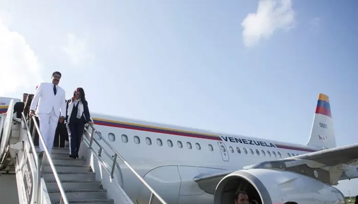 Venezuelas President Nicolas Maduro (L) and his wife and deputy of Venezuelas United Socialist Party (PSUV) Cilia Flores step out of their plane after arriving at the Las Americas airport in Santo Domingo, Dominican Republic August 16, 2016. — Reuters/File