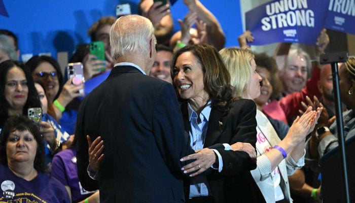 US President Joe Biden (left) embraces US Vice President and Democratic presidential candidate Kamala Harris greets during a campaign rally at the International Brotherhood of Electrical Workers (IBEW) Local 5 in Pittsburgh, Pennsylvania, on September 2, 2024. — AFP