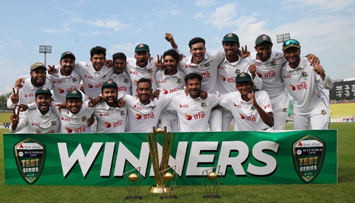 Bangladeshi players pose with the trophies after winning the two-match Test series against Pakistan at Rawalpindi Cricket Stadium on September 3, 2024. — PCB