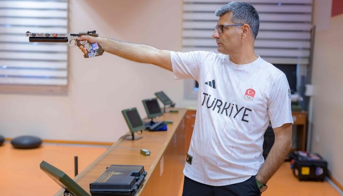 Silver medallist at the Paris 2024 Olympic Games, Turkish shooter Yusuf Dikec poses for a photograph in Ankara on August 9, 2024. —AFP