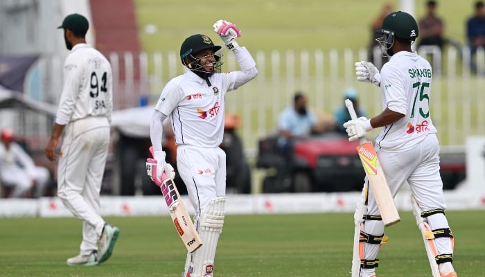 Bangladeshs Mushfiqur Rahim (L) and Shakib Al Hasan celebrate after winning the second Test match between Pakistan and Bangladesh, at Rawalpindi Cricket Stadium in Rawalpindi on September 3, 2024. —AFP