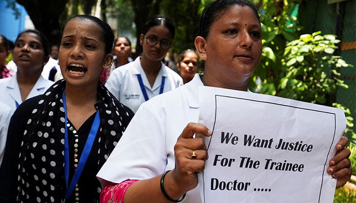 Doctors and residents hold posters and shout slogans during a protest condemning the rape and murder of a trainee medic at a government-run hospital in Kolkata, at a ground in Mumbai, India, August 18, 2024. — Reuters