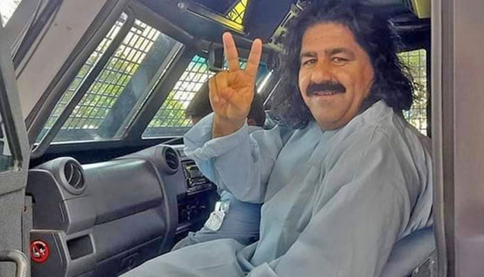 PTM leader and former MNA Ali Wazir gestures for a photo while being in polices custody in this undated image. — Facebook/Ali Wazir/File