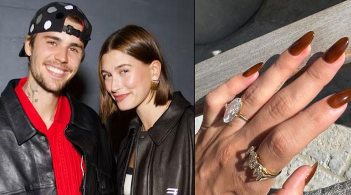 Hailey Bieber shows off new ‘MOM' ring