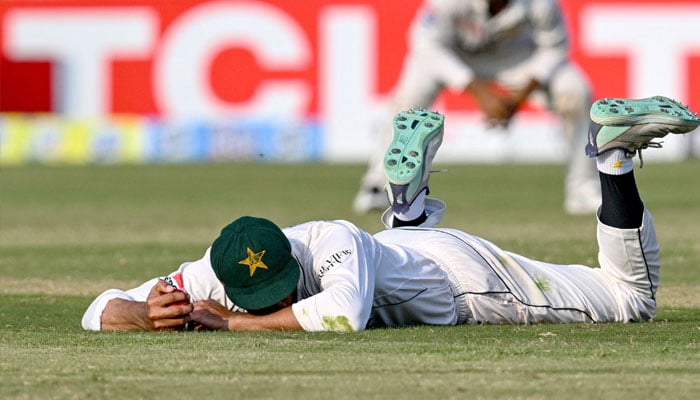 Pakistan´s captain Shan Masood reacts after dropping a catch during the third day of the second and last Test cricket match between Pakistan and Bangladesh, at the Rawalpindi Cricket Stadium in Rawalpindi on September 1, 2024. — AFP