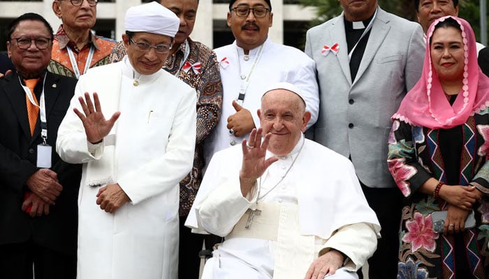 Pope Francis poses for a family photo with the Grand Imam of the Mosque Nasaruddin Umar and other religious leaders at an inter-religious meeting, at the Istiqlal Mosque in Jakarta, Indonesia, September 5, 2024. — Reuters