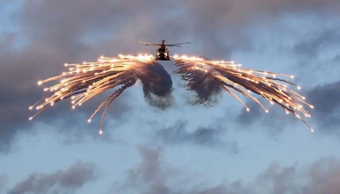 The Royal Navys Merlin helicopter from 820 Naval Air Squadron, fires flares after being airborne from HMS Prince of Wales, while embarked for NATO Exercise Steadfast Defender 2024, at an undisclosed location in this handout image released on February 28, 2024. — Reuters