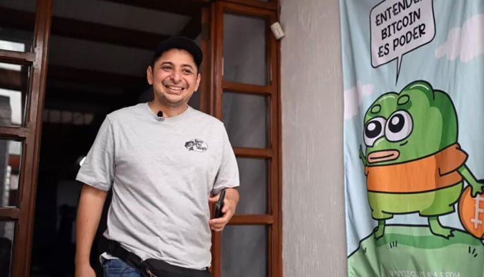 Taxi driver Napoleon Osorio leaves the NGO My First Bitcoin headquarters in San Salvador on September 4, 2024. — AFP