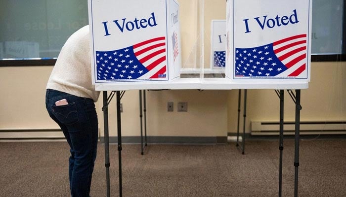 A voter casts vote in US. — AFP/File