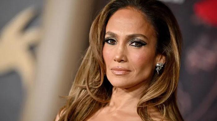 Jennifer Lopez looks stunning in a chiffon dress at the Golden Globes pre-party