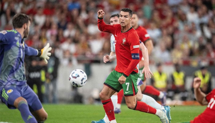 Cristiano Ronaldo scores a goal during the UEFA Nations League football match, group A, between Portugal and Scotland at Luz stadium in Lisbon on September 8, 2024. — AFP