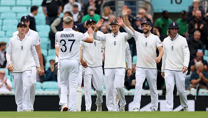 Englands Gus Atkinson celebrates with teammates after taking the wicket of Sri Lankas Kusal Mendis during third Test match between England and Sri Lanka at The Oval, London, September 9, 2024. — Reuters