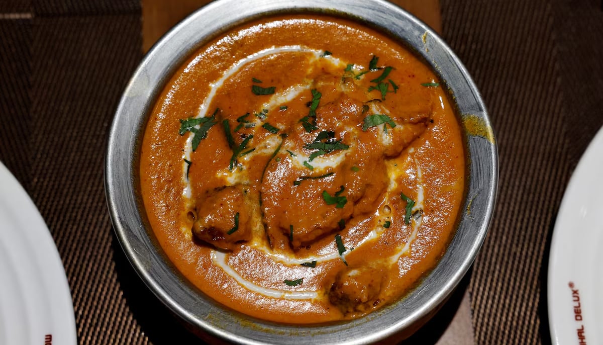 A freshly prepared butter chicken dish is placed on a table inside the Moti Mahal Delux restaurant in New Delhi, India, January 23, 2024. — Reuters