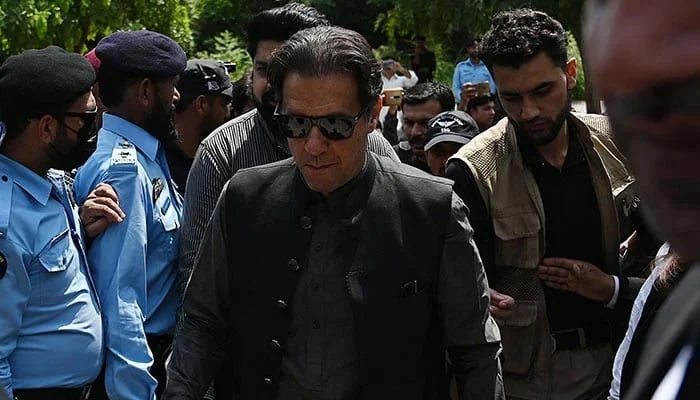 PTI founder Imran Khan (centre) arrives to appear before the anti-terrorism court in Islamabad on September 1, 2022. — AFP/File