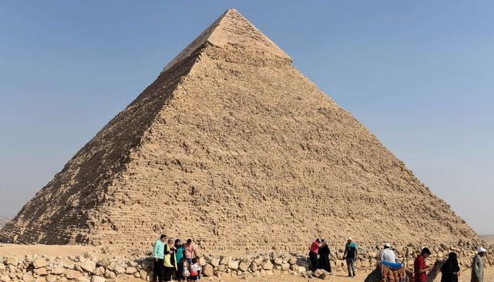 The Great Pyramid of Giza surrounded by tourists in Egypt. — AFP/File