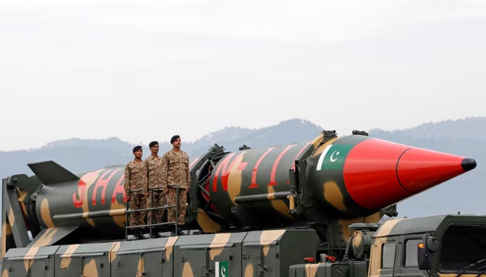 Pakistani military personnel stand beside a Shaheen III surface-to-surface ballistic missile during Pakistan Day military parade in Islamabad, Pakistan March 23, 2019. — Reuters