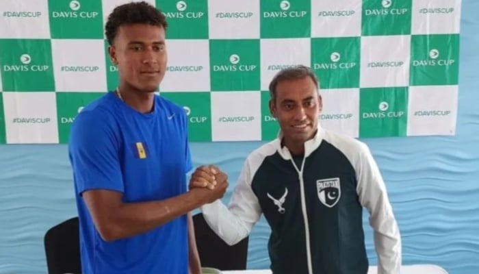 Pakistan tennis player Aqeel Khan posing for a photo with a Barbados player on September 15, 2024. —Instagram/ @pakistantennisfederation