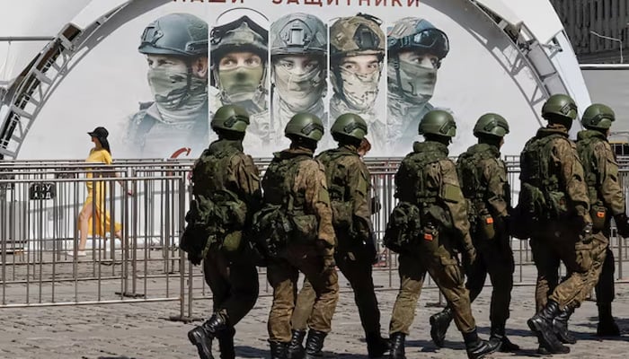 Russian army servicemen walk at an exhibition displaying armoured vehicles and equipment captured by the Russian army from Ukrainian forces in the course of Russia-Ukraine conflict, at Victory Park open-air museum in Moscow. — Reuters