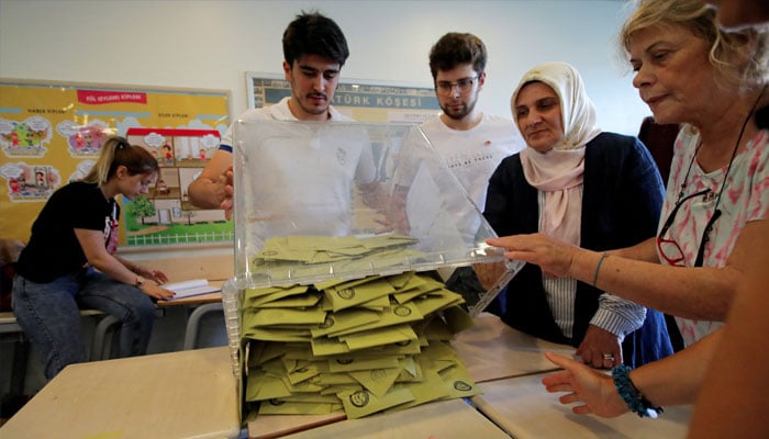 Election officials open a ballot box to count votes at a polling station in Istanbul, Turkey, June 23, 2019. —Reuters