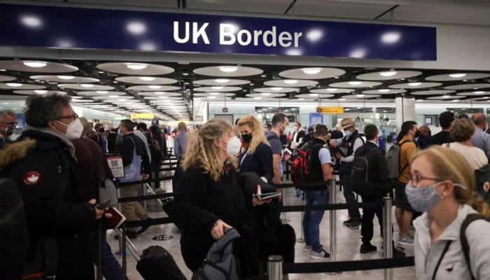 Arriving passengers queue at UK Border Control at the Terminal 5 at Heathrow Airport in London, Britain June 29, 2021. — Reuters