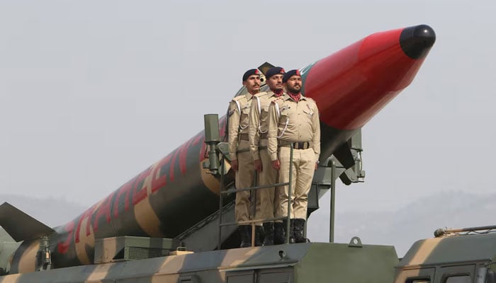 Pakistani soldiers stand on a vehicle carrying the Shaheen long-range ballistic missile during a parade in Islamabad on March 23, 2022. — AFP