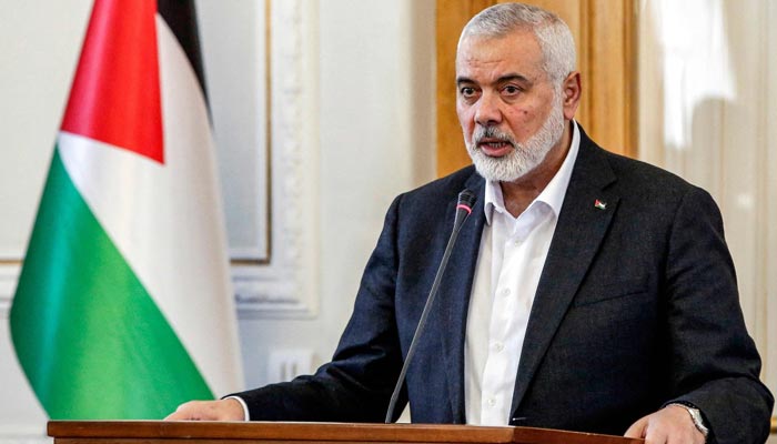 Ismail Haniyeh, the Doha-based political bureau chief of the Palestinian resistance movement Hamas, speaks to the press after a meeting with the Iranian foreign minister in Tehran on March 26, 2024.