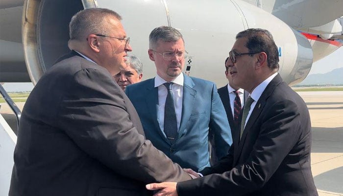 Russias Deputy Prime Minister Alexei Overchuk (left) interacts with Pakistani officials upon his arrival in Islamabad on September 18, 2024. — Foreign Office