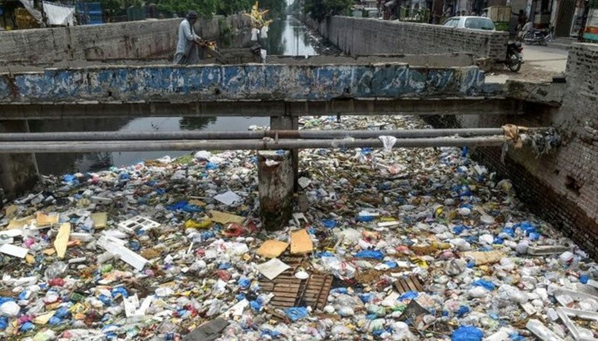 A representational image of trash floating on a flowing nullah. — AFP/File