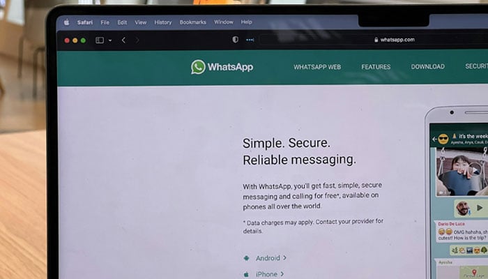 A representational image shows WhatsApp Webs homepage displayed on a desktop. — Unsplash