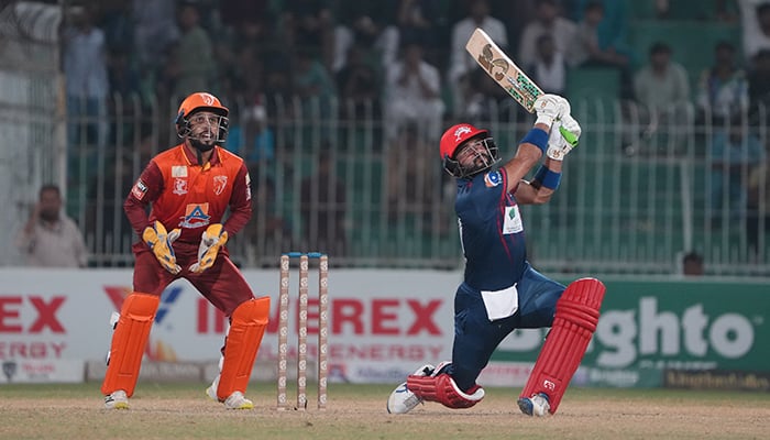 Wicket-keeper and captain of  Stallions, Mohammad Haris looks on as Sahibzada Farhan of the Dolphins play a shot on September 19, 2024 at Iqbal Stadium, Faisalabad. — PCB