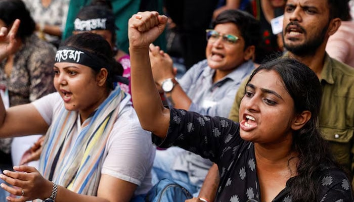 Medics sit and chant slogans as they attend a protest condemning the rape and murder of a trainee medic at a government-run hospital, in Kolkata, India, September 10, 2024. — Reuters