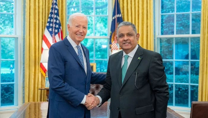 US President Joe Biden (left) shakes hand with Pakistans Ambassador Rizwan Saeed Sheikh. — Supplied/File