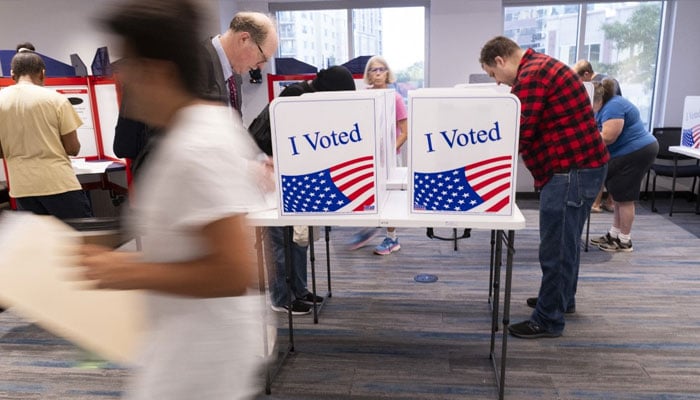 Voters work on their ballot at a polling station at the Elena Bozeman Government Centre in Arlington, Virginia, on September 20, 2024. — AFP