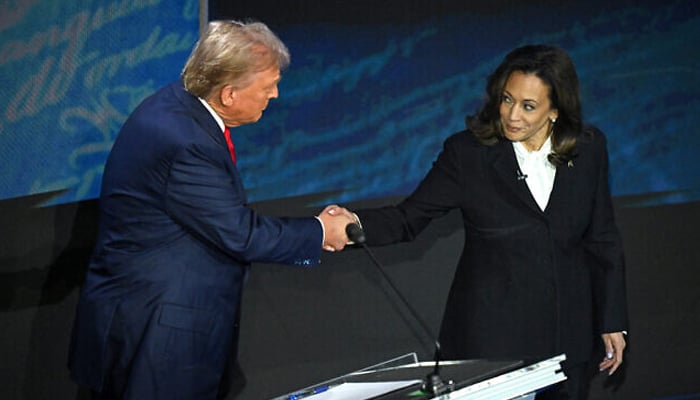 Former US president and Republican presidential candidate Donald Trump (L) shakes hands with US Vice President and Democratic presidential candidate Kamala Harris during a presidential debate at the National Constitution Center in Philadelphia, Pennsylvania, on September 10, 2024. — AFP