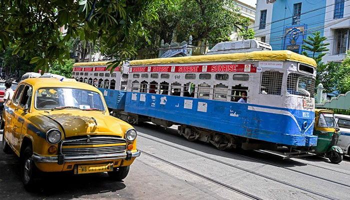 Passengers commute in a tram along a street in Kolkata in this photo taken on September 8, 2024. — AFP