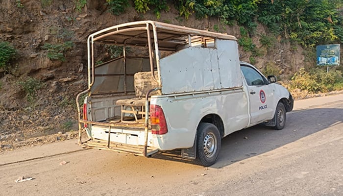 This photo shows KP police mobile van targeted in a bomb explosion at Malam Jabba Road on September 22, 2024. — Reporter