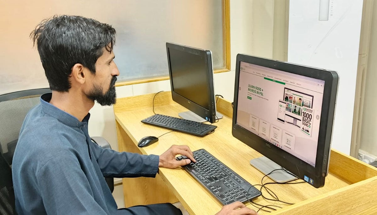 Zahid prepares a computer training session for deaf students at Deaf Reach School in Karachi on September 19, 2024. — Photo by author